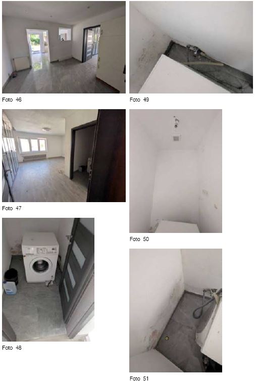 Wohnung, Waschmaschine und Tür im Vorraum, Waschbecken und Rohre in der Ecke